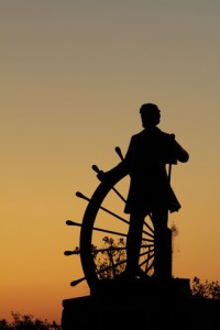 Mark Twain at the helm of a river boat
